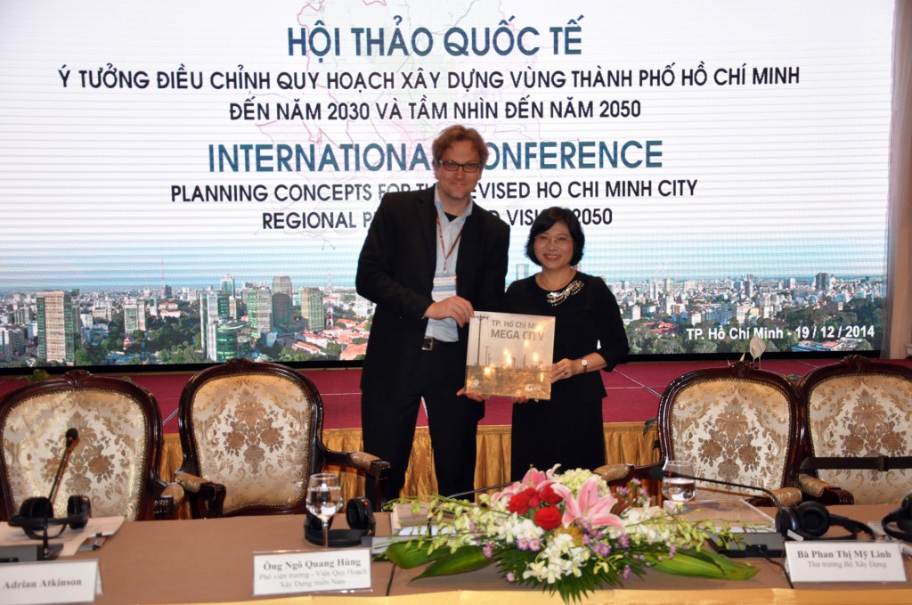 2014_12_19_HCMCR_Plan2030_Conference_Hand-Over_Ms.Linh_Vice-Minister_MoC